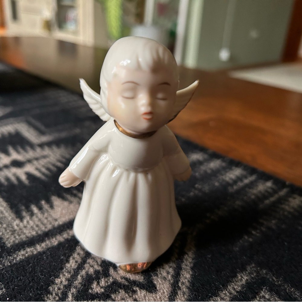 Vintage Christmas angel figurine kissing gold trim.